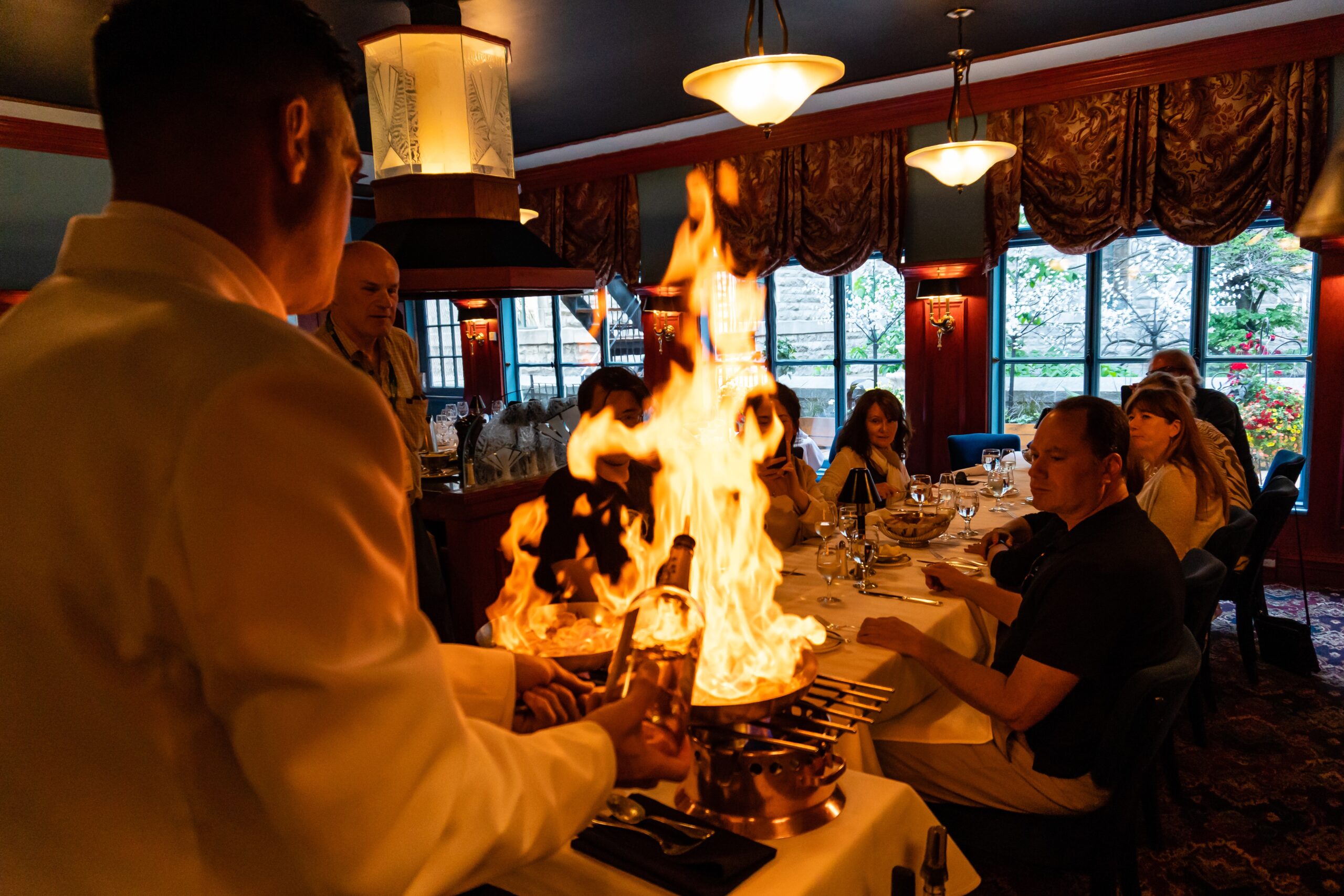 Live Shrimp Flambé by table side during Evening Gourmet Food Tour in Quebec City, Le Continental, Canada