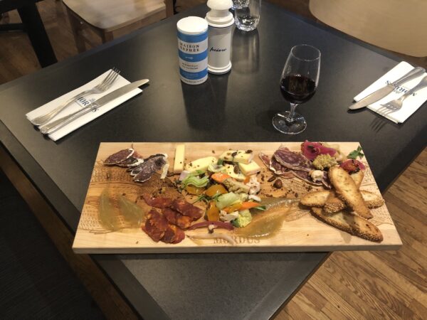 Brasserie Les Mordus, beautiful charcuterie plate with marinated vegetables and sausages and cold cuts from Charlevoix region.