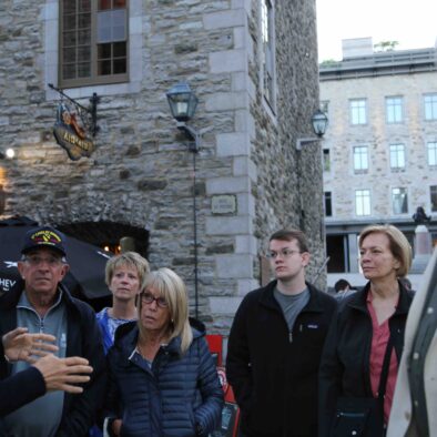 Combo Historical and Food tour of Old Quebec City, group focused on guide's presentation in the Place Royale